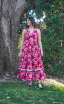 Petal Song Halter Dress - Model standing infront of a tree